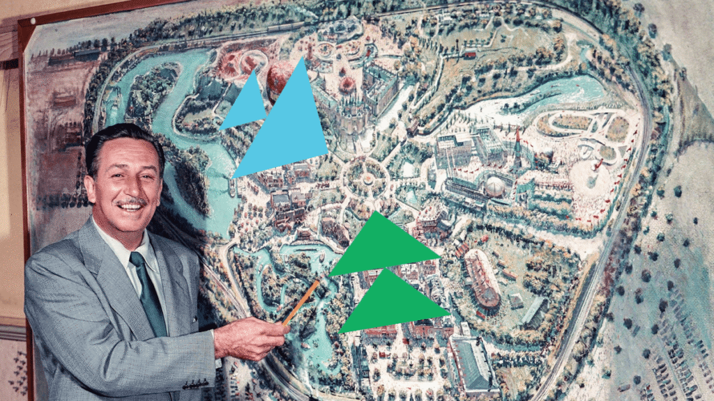 Walt Disney pointing to a Disneyland park map