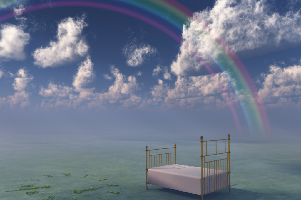 Rainbow over calm water and sky