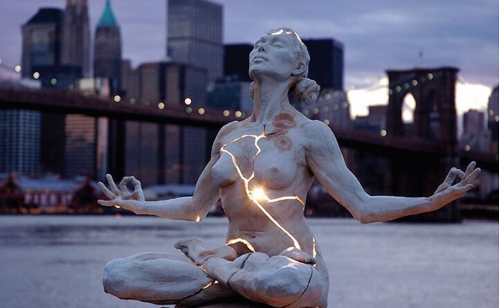 Paige Bradley sculpture illuminated at dusk